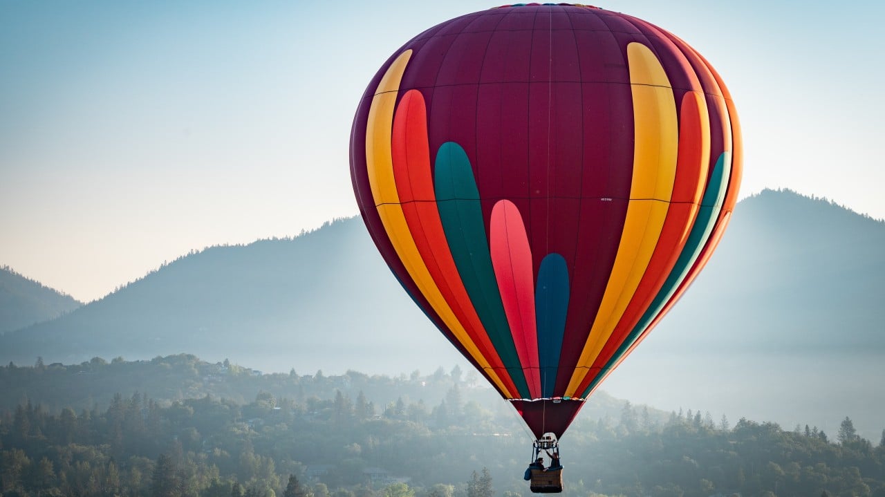 Colorful hot air balloon over Grants Pass Oregon on a beautiful summer morning By just.b photography(Adobe Stock Photos)