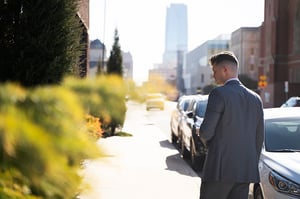 man walking down a city sidewalk