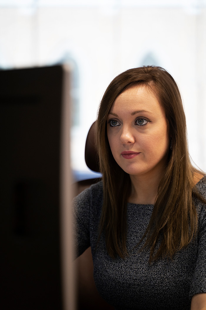 woman looking very seriously to the right of the camera