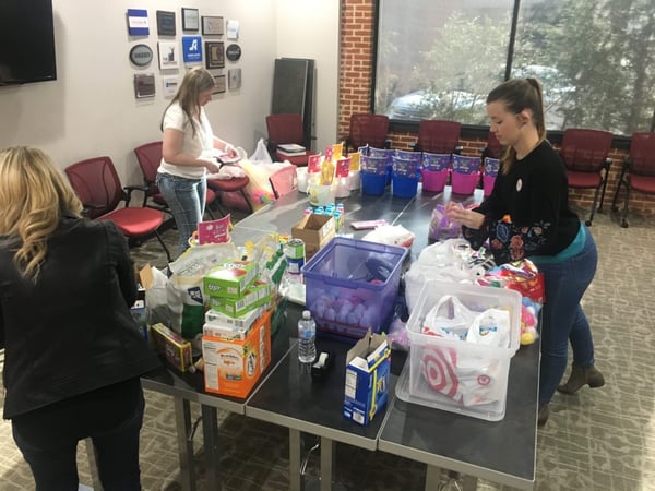 volunteers building easter buckets