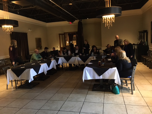 team enjoying lunch around a table