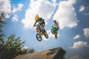 dirt bikers going over a jump